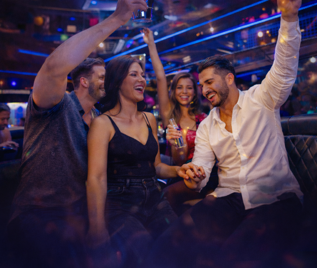 Group celebration inside Atlanta party bus rental